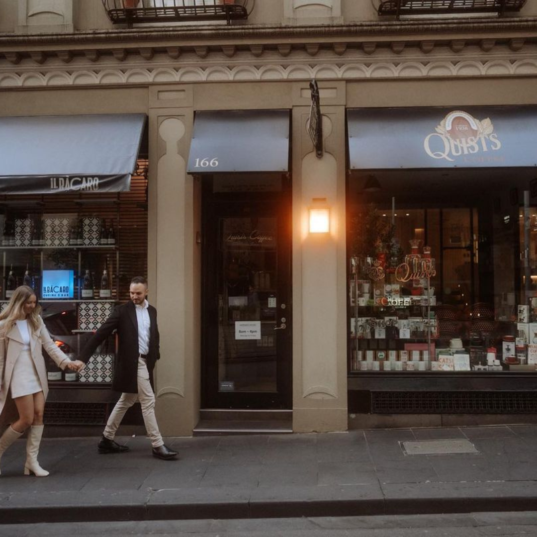 Couple walking outside quists cafe